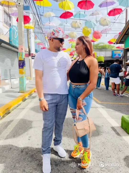 Couple in Colorful Street Amid Festive Vibes – AI Generated Video | Hailuo AI