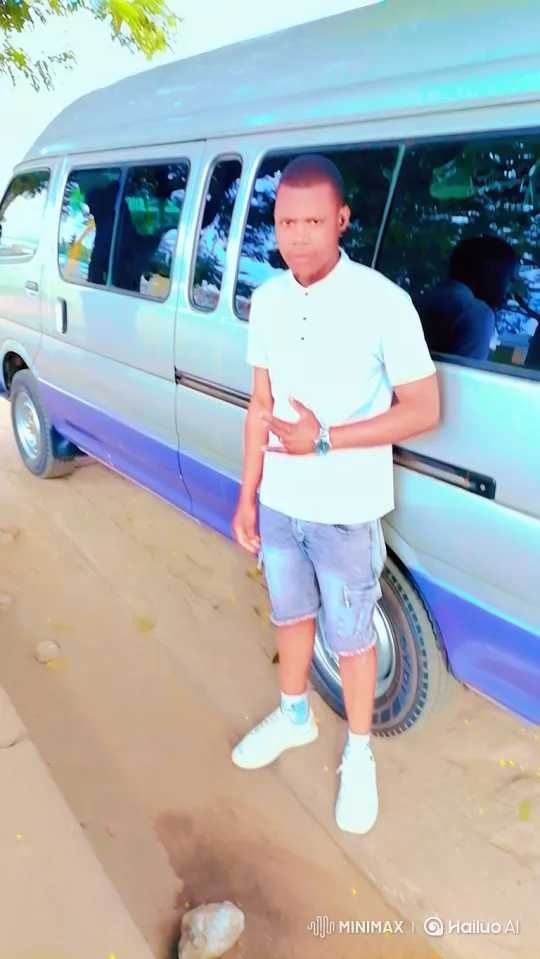 Young Man Stands by Van, Expresses Calmness and Greeting – AI Generated Video | Hailuo AI