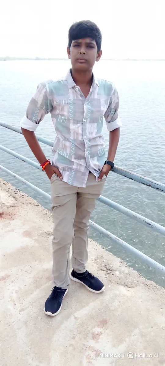 Young Boy Stands by Water, Evokes Serenity and Simplicity – AI Generated Video | Hailuo AI