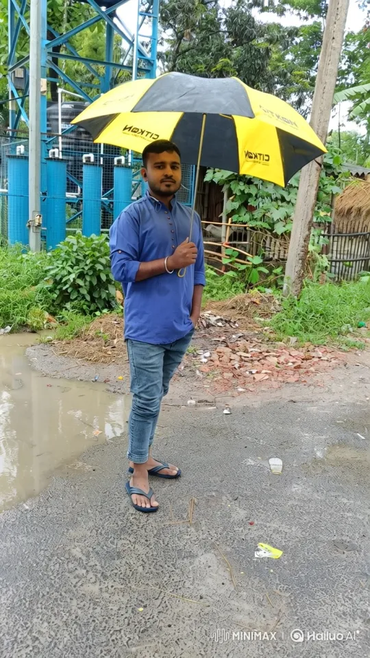 Man Walks Leftward Under Umbrella on Wet Road – AI Generated Video | Hailuo AI