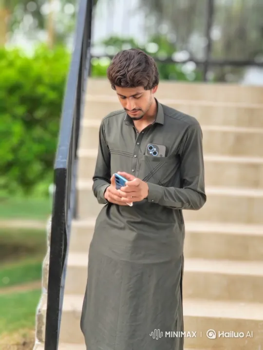 Young Man Engages with Smartphone on Staircase – AI Generated Video | Hailuo AI