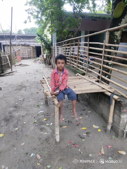 Young Boy Sits in Tranquil Village Courtyard – AI Generated Video | Hailuo AI