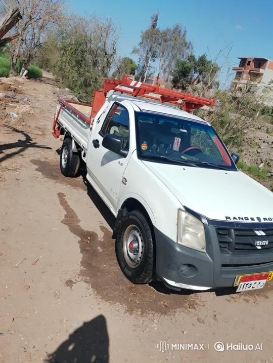 White Isuzu Pickup Navigates Uneven Dirt Road – AI Generated Video | Hailuo AI