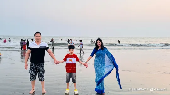 Family Pose on Wet Beach with Gentle Waves – AI Generated Video | Hailuo AI