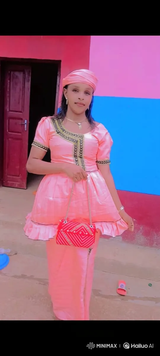 Woman in Luminous Pink Outfit, Graceful Camera Tracking – AI Generated Video | Hailuo AI