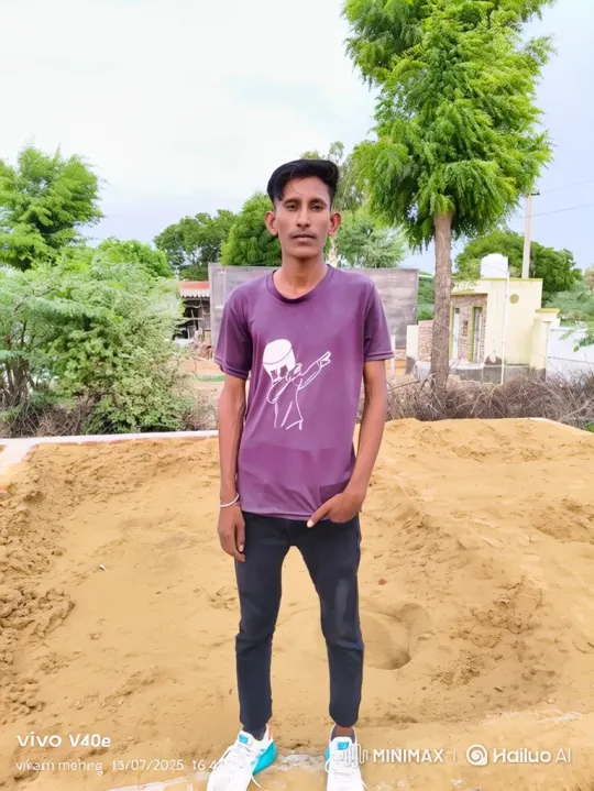 Young Man in Purple T-Shirt Stands by Sandpile – AI Generated Video | Hailuo AI