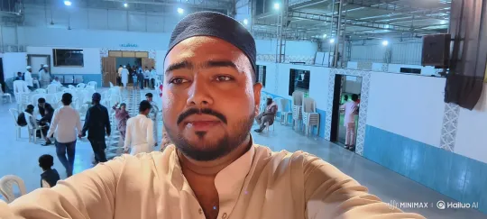 Man Captures Selfie in Serene Community Hall Setting – AI Generated Video | Hailuo AI