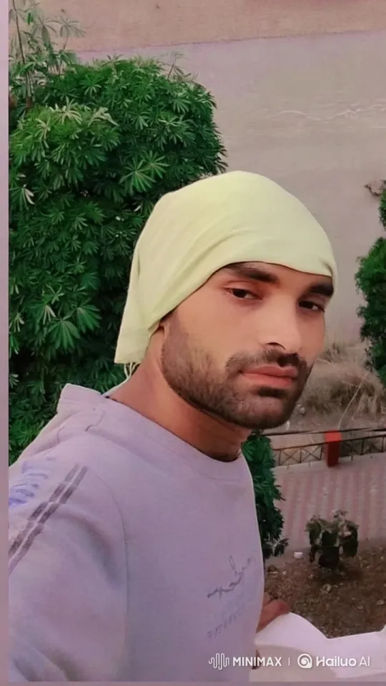 Young Man in Turban Amidst Greenery Reflects Calmly – AI Generated Video | Hailuo AI
