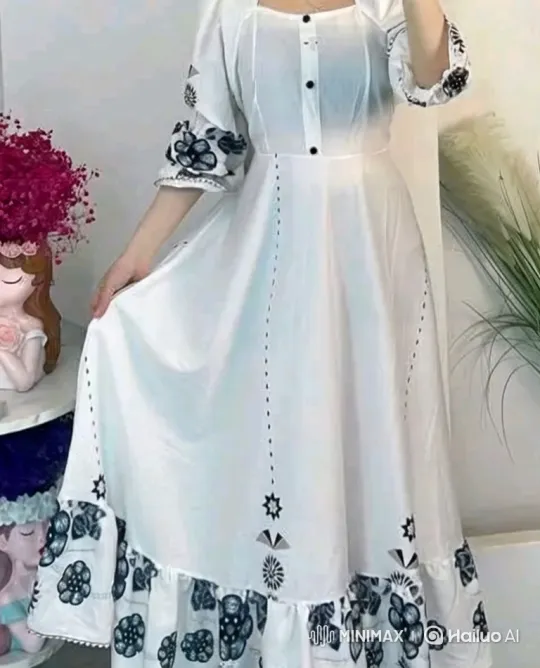 Woman Models Elegant White Dress with Floral Embroidery – AI Generated Video | Hailuo AI