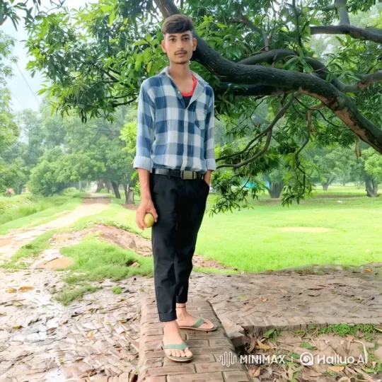 Young Man in Park with Ball and Gentle Smile – AI Generated Video | Hailuo AI
