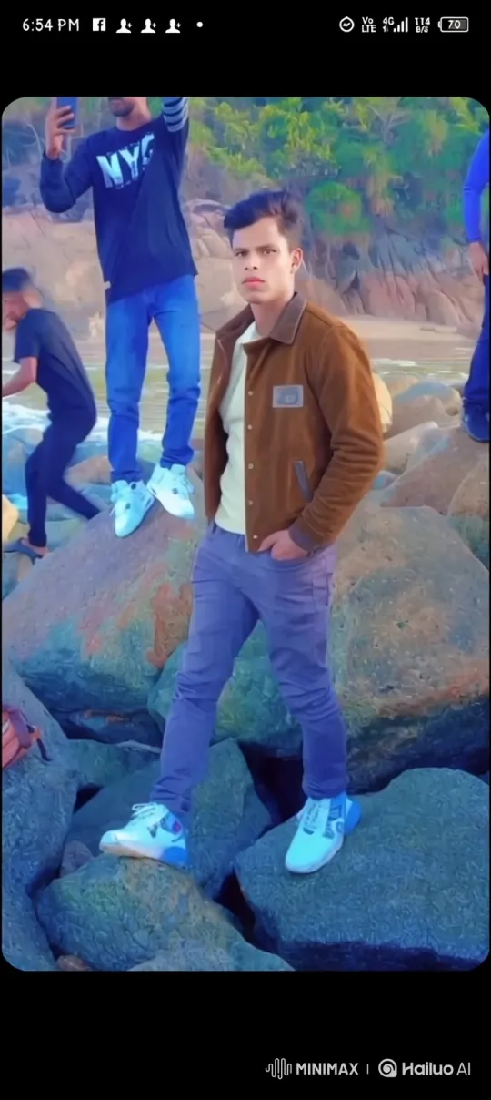 Young Couple Shares Moment of Connection on Rocky Shoreline – AI Generated Video | Hailuo AI