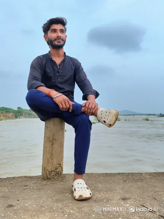 Contemplative Man Ponders by a Muddy River – AI Generated Video | Hailuo AI
