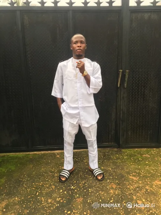 Confident Man Poses at Metal Gate – AI Generated Video | Hailuo AI