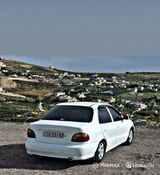 White Sedan Demonstrates Air Suspension Over Scenic Hill – AI Generated Video | Hailuo AI