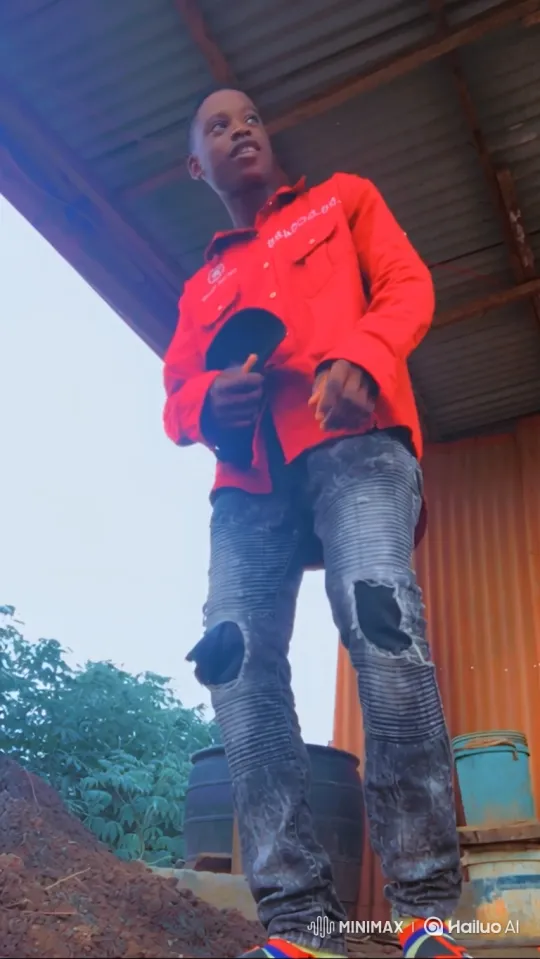 Young Man in Red Shirt Walks with Confidence – AI Generated Video | Hailuo AI