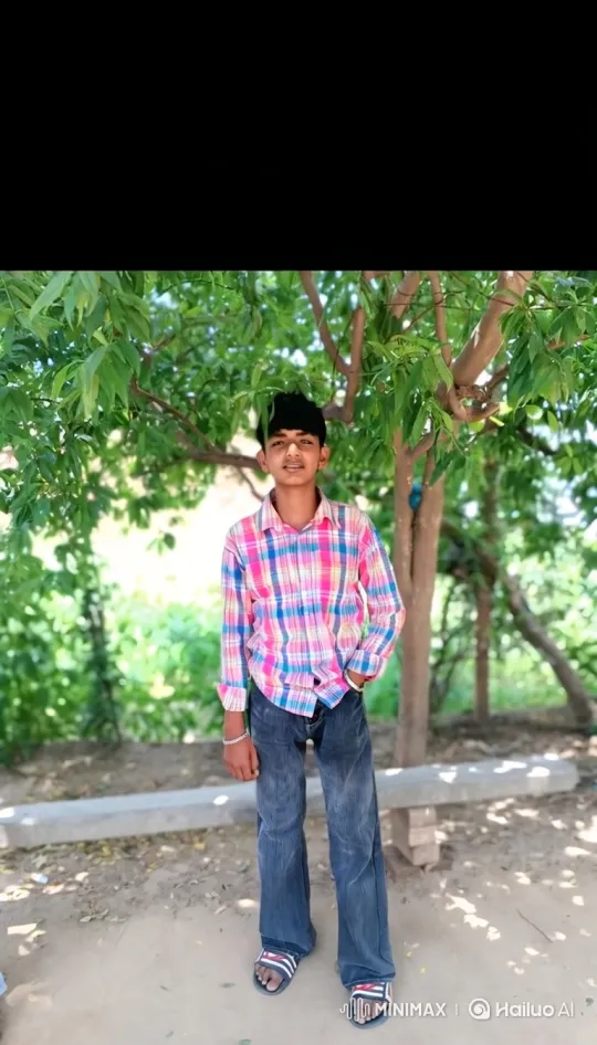 Boy in Plaid Shirt Stands Under Swaying Tree – AI Generated Video | Hailuo AI