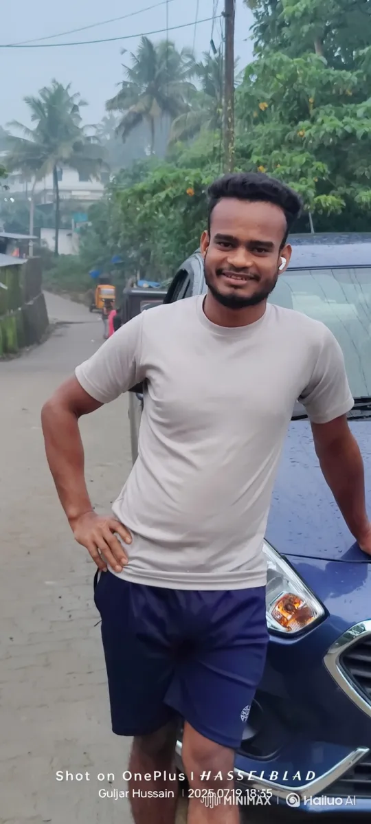 Actor Smiles Warmly Against Blue Car in Overcast Day Setting – AI Generated Video | Hailuo AI