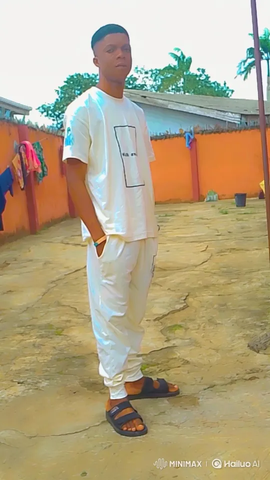 Young Man in White Outfit Walks Across Courtyard – AI Generated Video | Hailuo AI