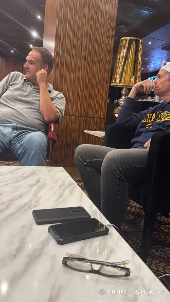 Two Men Share Intimate Moment in Lounge – AI Generated Video | Hailuo AI