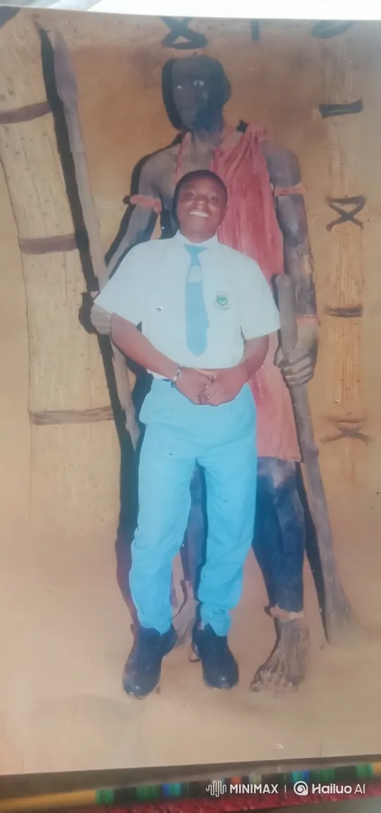 Boy in Uniform Poses with Warrior Statue – AI Generated Video | Hailuo AI
