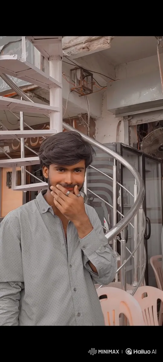 Young Man Reveals Smile in Stylish Setting – AI Generated Video | Hailuo AI