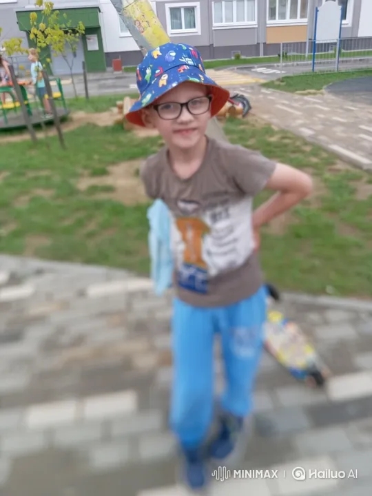 Young Boy in Blue Bucket Hat Walking in Playground – AI Generated Video | Hailuo AI