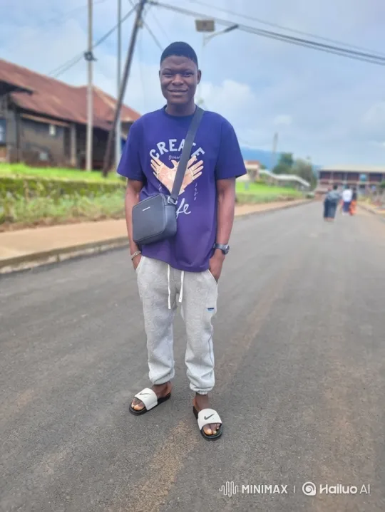 Young Man Approaches Camera on Paved Road – AI Generated Video | Hailuo AI