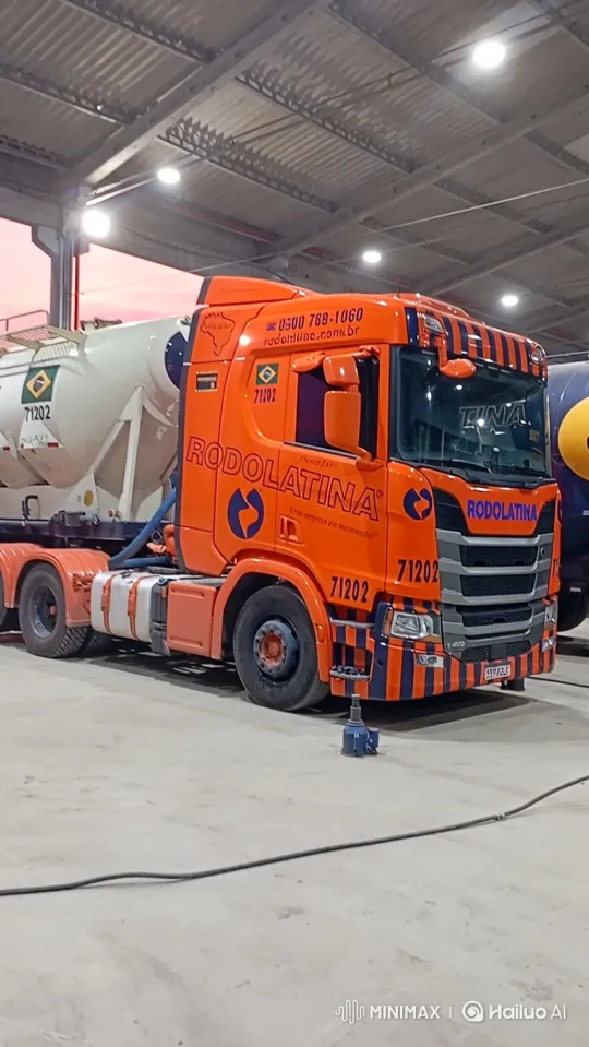 Orange Scania Truck Lowering in Warehouse at Dusk – AI Generated Video | Hailuo AI