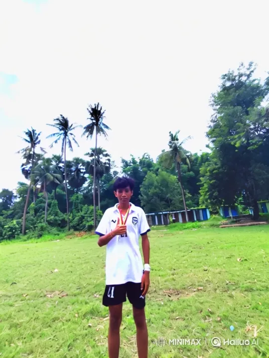 Boy in Victory Pose Amidst Expansive Landscape – AI Generated Video | Hailuo AI