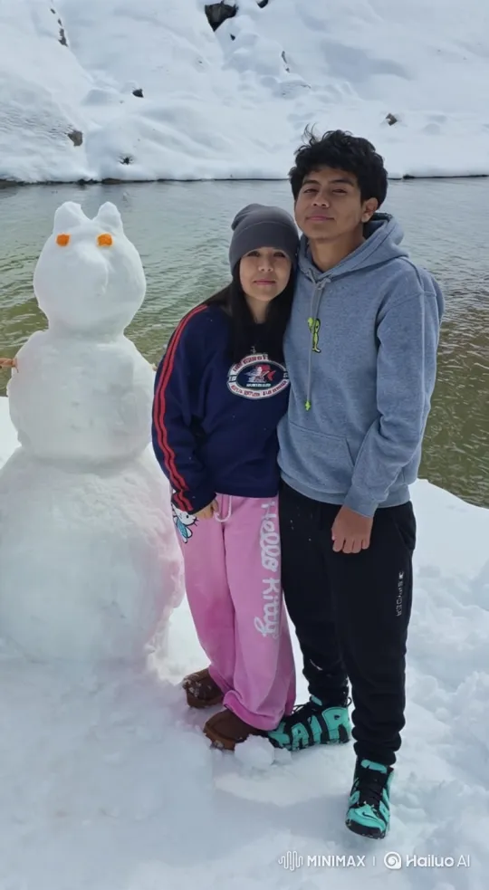 Family Embraces in Snowy Winter Landscape – AI Generated Video | Hailuo AI