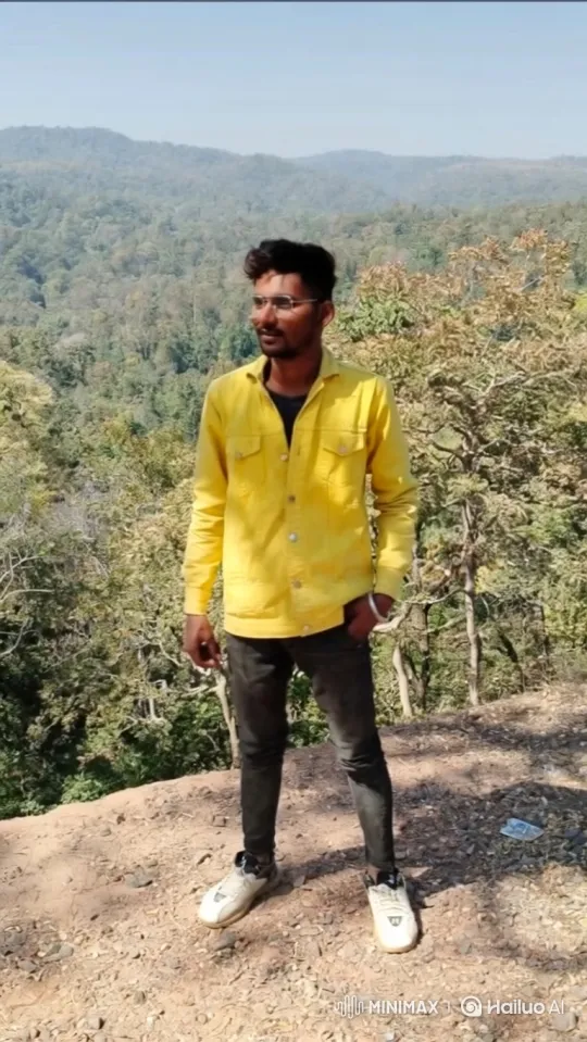 Young Man Contemplates Nature on a Windy Cliff – AI Generated Video | Hailuo AI