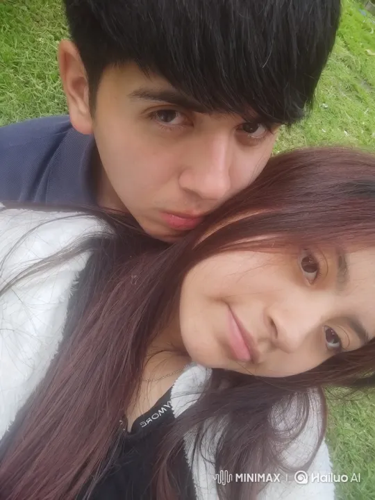 Young Family's Intimate Moment on Green Lawn – AI Generated Video | Hailuo AI