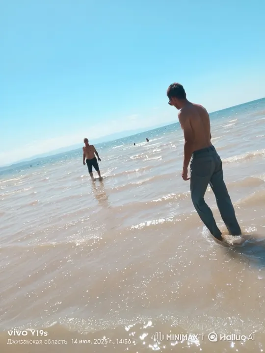 Beach Scene: Two Men in Water, Pan and Zoom – AI Generated Video | Hailuo AI