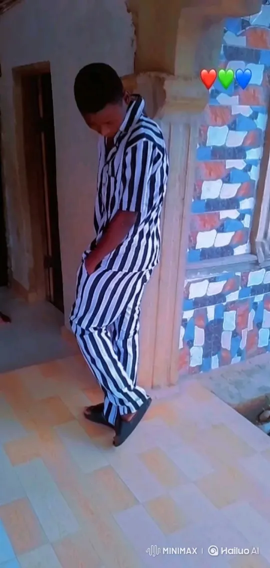 Person in Striped Pajamas Shifts Pose Indoors – AI Generated Video | Hailuo AI