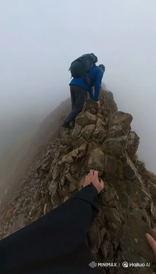Climber's Perilous Journey on Foggy Mountain Ridge – AI Generated Video | Hailuo AI