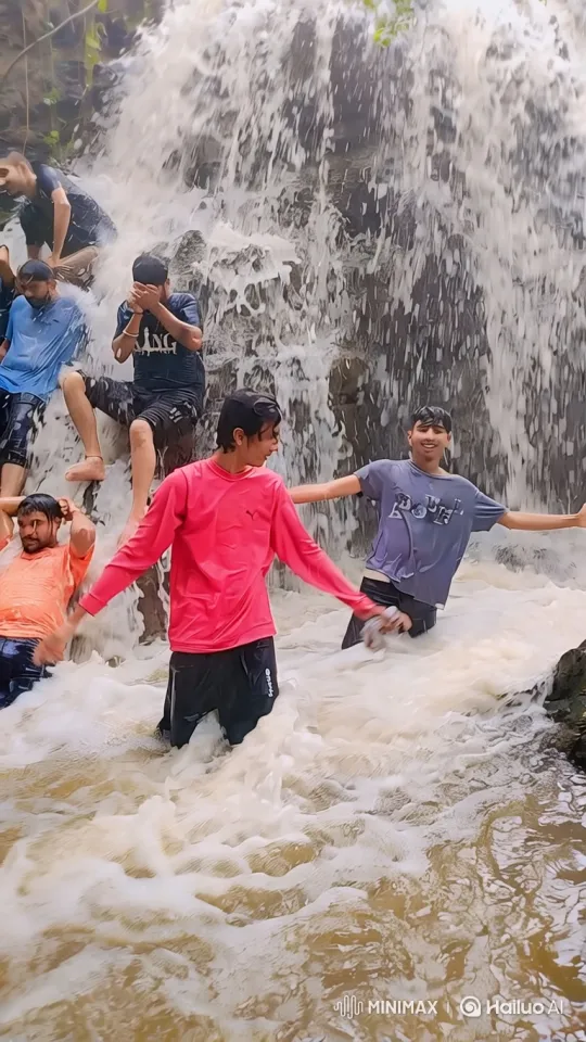 Young Men Enjoy Waterfall, Earth Revealed in Space – AI Generated Video | Hailuo AI
