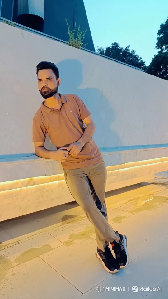Man in Thoughtful Pose Against Twilight Sky – AI Generated Video | Hailuo AI