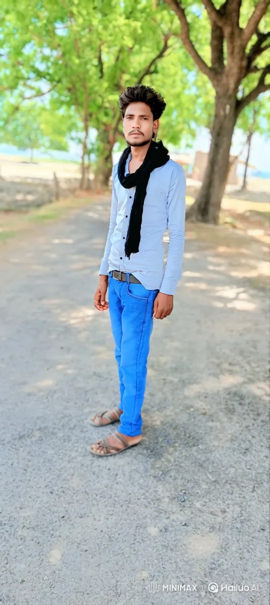 Young Man Smiles Gently in Park Setting – AI Generated Video | Hailuo AI