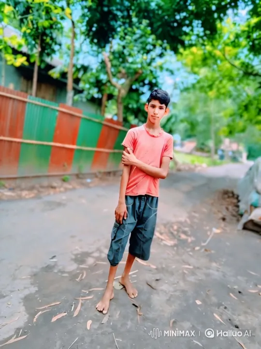 Young Boy Walking Along Fence on Dirt Path – AI Generated Video | Hailuo AI