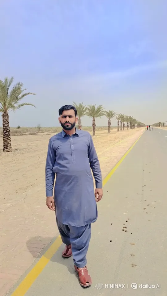 Man Walking on Desert Road with Expansive Landscape – AI Generated Video | Hailuo AI