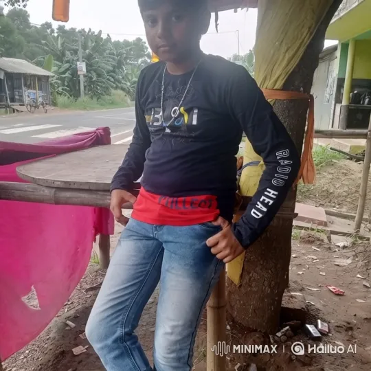 Young Boy Poses Confidently in Outdoor Countryside Setting – AI Generated Video | Hailuo AI