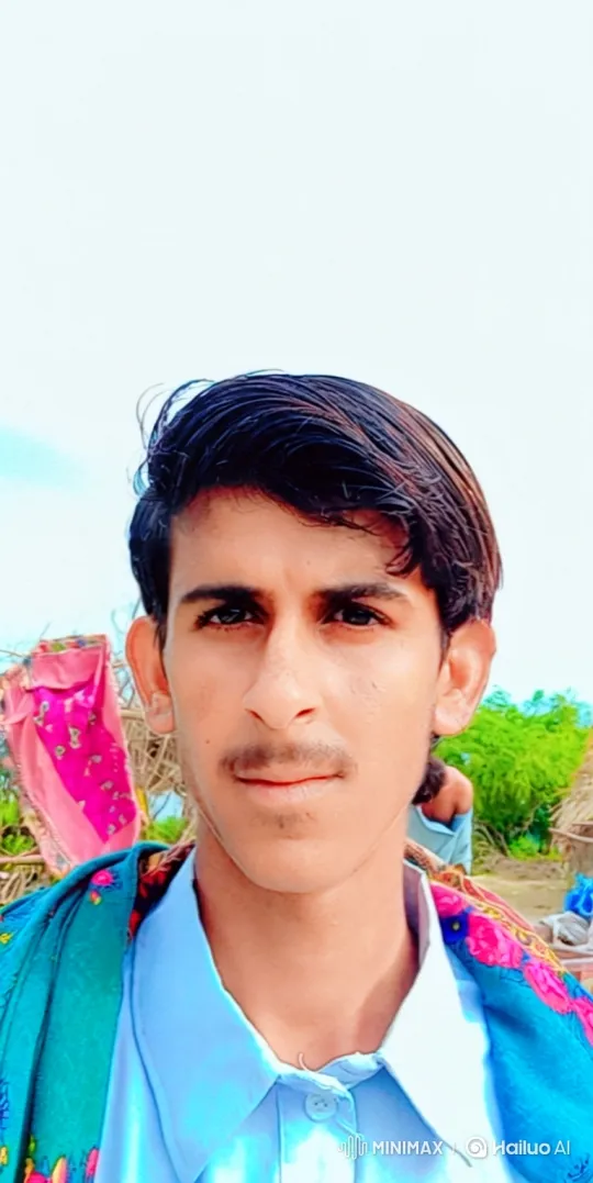 Young Man Smiles Gently in Outdoor Setting – AI Generated Video | Hailuo AI