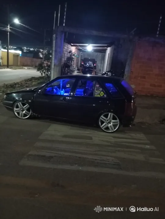 Modified Hatchback Lowers on Air Suspension at Night – AI Generated Video | Hailuo AI