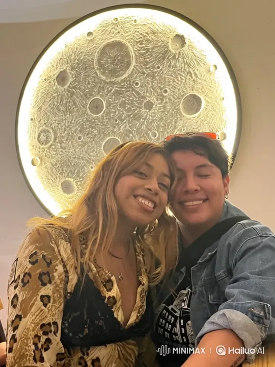 Family Embrace Captured in Gallery Setting – AI Generated Video | Hailuo AI