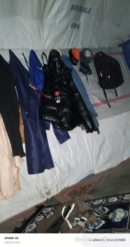 Clothes and Belongings Inside a Tent or Shelter – AI Generated Video | Hailuo AI