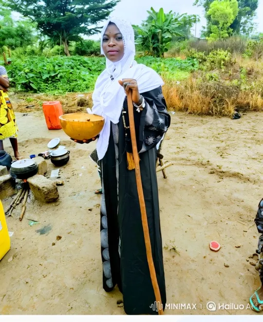 Woman Stands with Bowl and Staff in Natural Setting – AI Generated Video | Hailuo AI