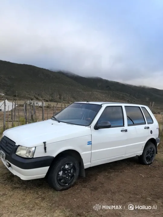 White Hatchback Lowering Suspension in Mountainous Landscape – AI Generated Video | Hailuo AI