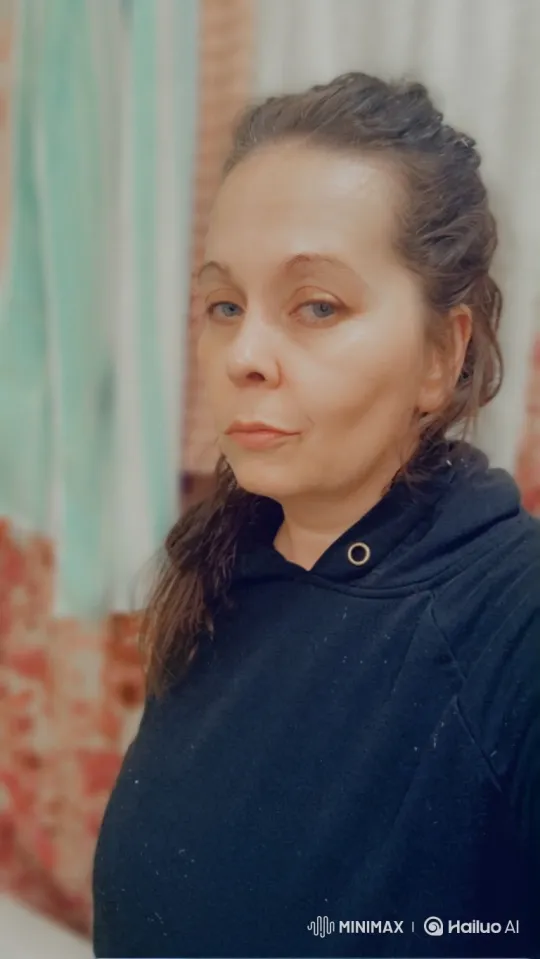 Woman in Black Hoodie: Contemplative and Steady Gaze – AI Generated Video | Hailuo AI