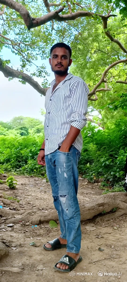 Young Man Smiling in Serene Forest Setting – AI Generated Video | Hailuo AI