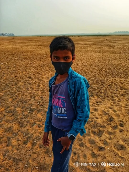 Young Boy Stares Into Camera in Vast Desert Landscape – AI Generated Video | Hailuo AI